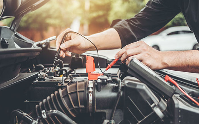 Technician servicing vehicle 